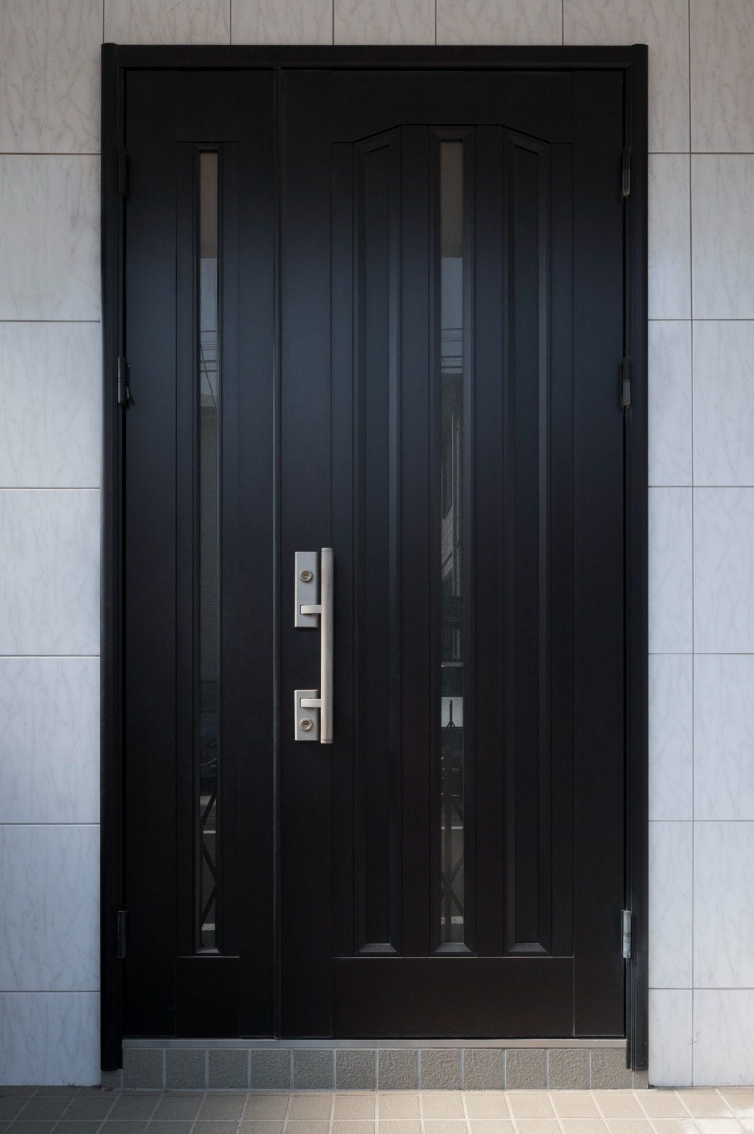 Engineered steel safety door installed at a commercial facility entrance